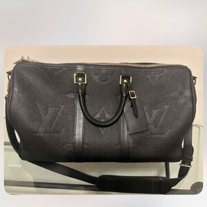 Louis Vuitton Black Duffel Bag with Gold Accents